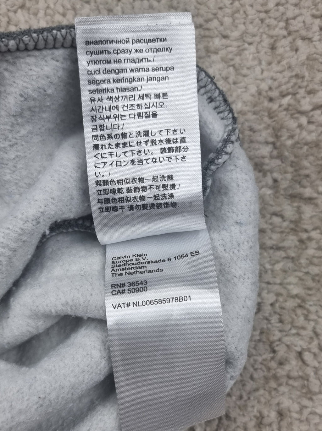 Sudadera Calvin Klein gris con media cremallera talla M