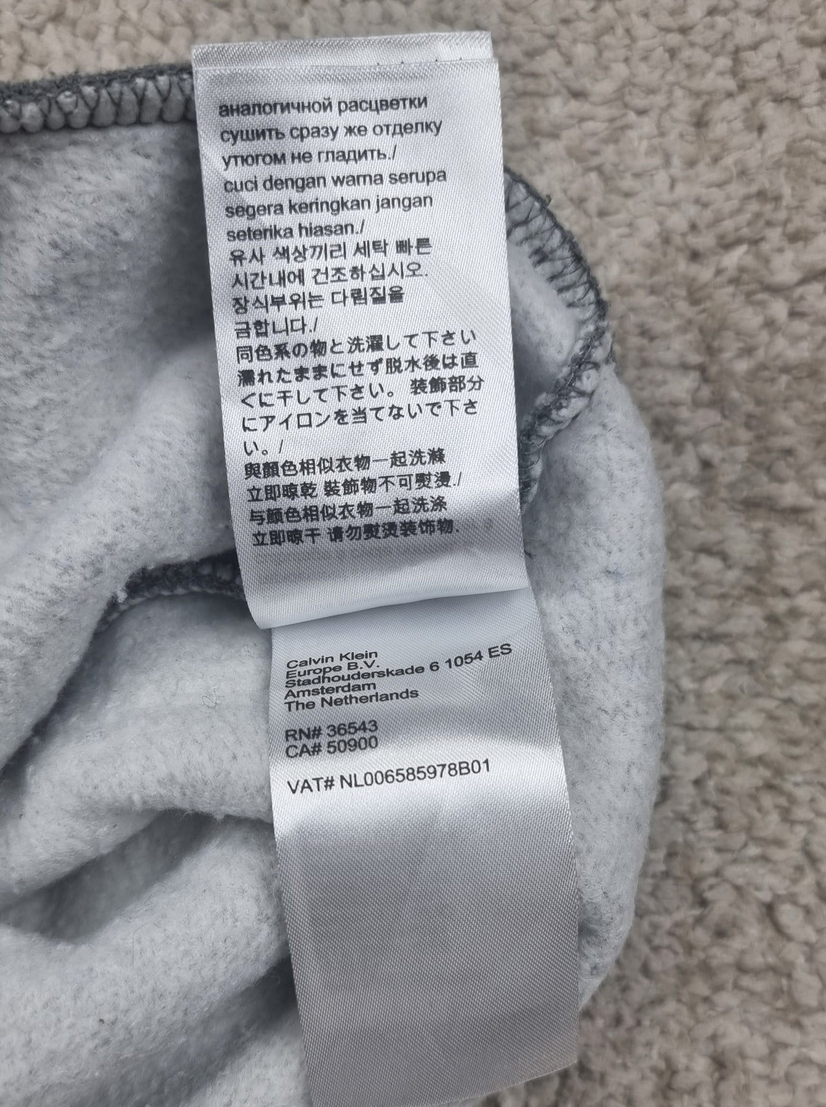 Sudadera Calvin Klein gris con media cremallera talla M